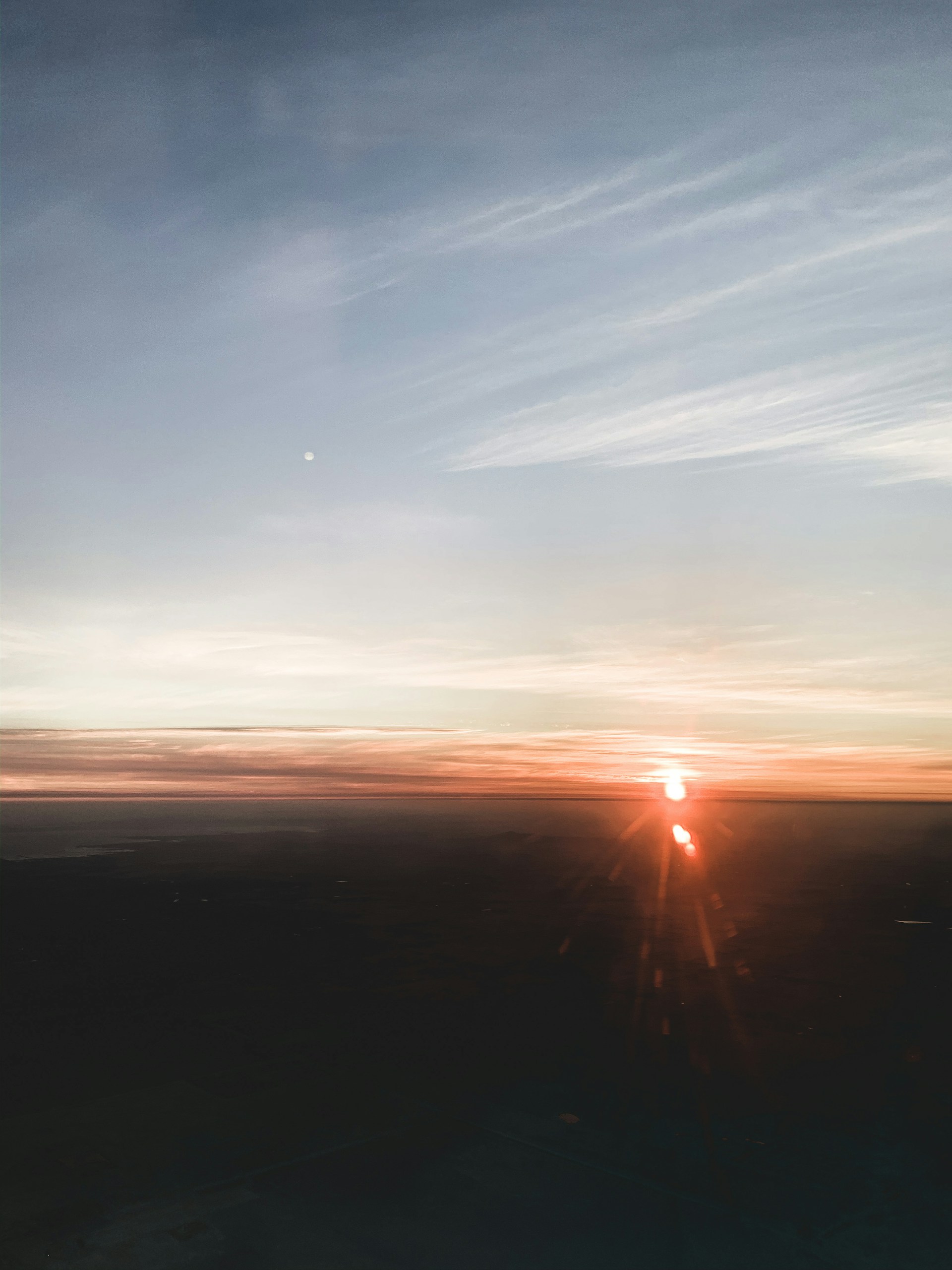 A smooth gradient sunrise simulation with delicate rays spreading warmth, symbolizing fresh possibilities on the horizon.