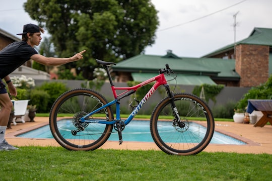 red and blue full-suspension mountain bicycle in Johannesburg South Africa