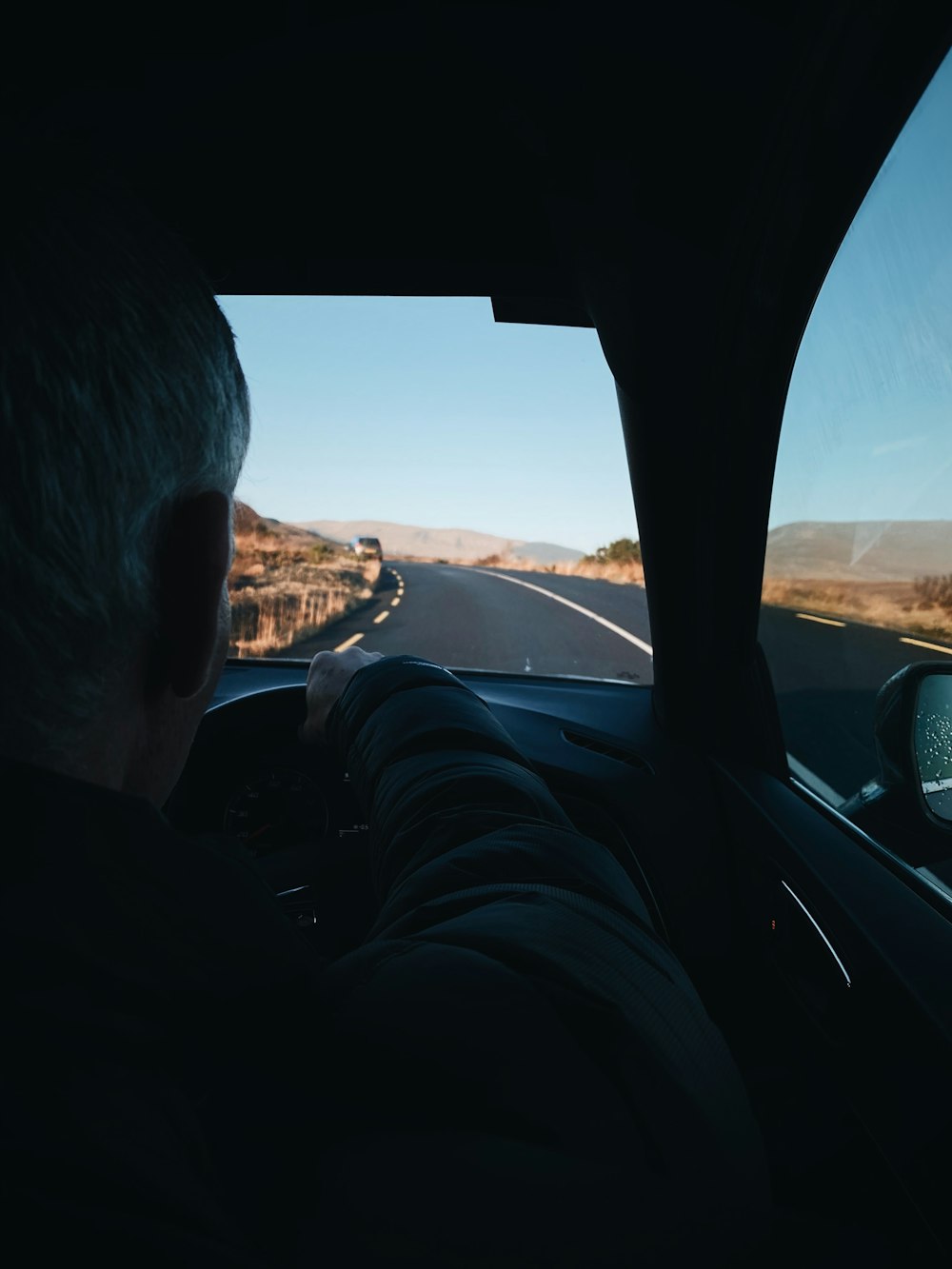 man driving a vehicle