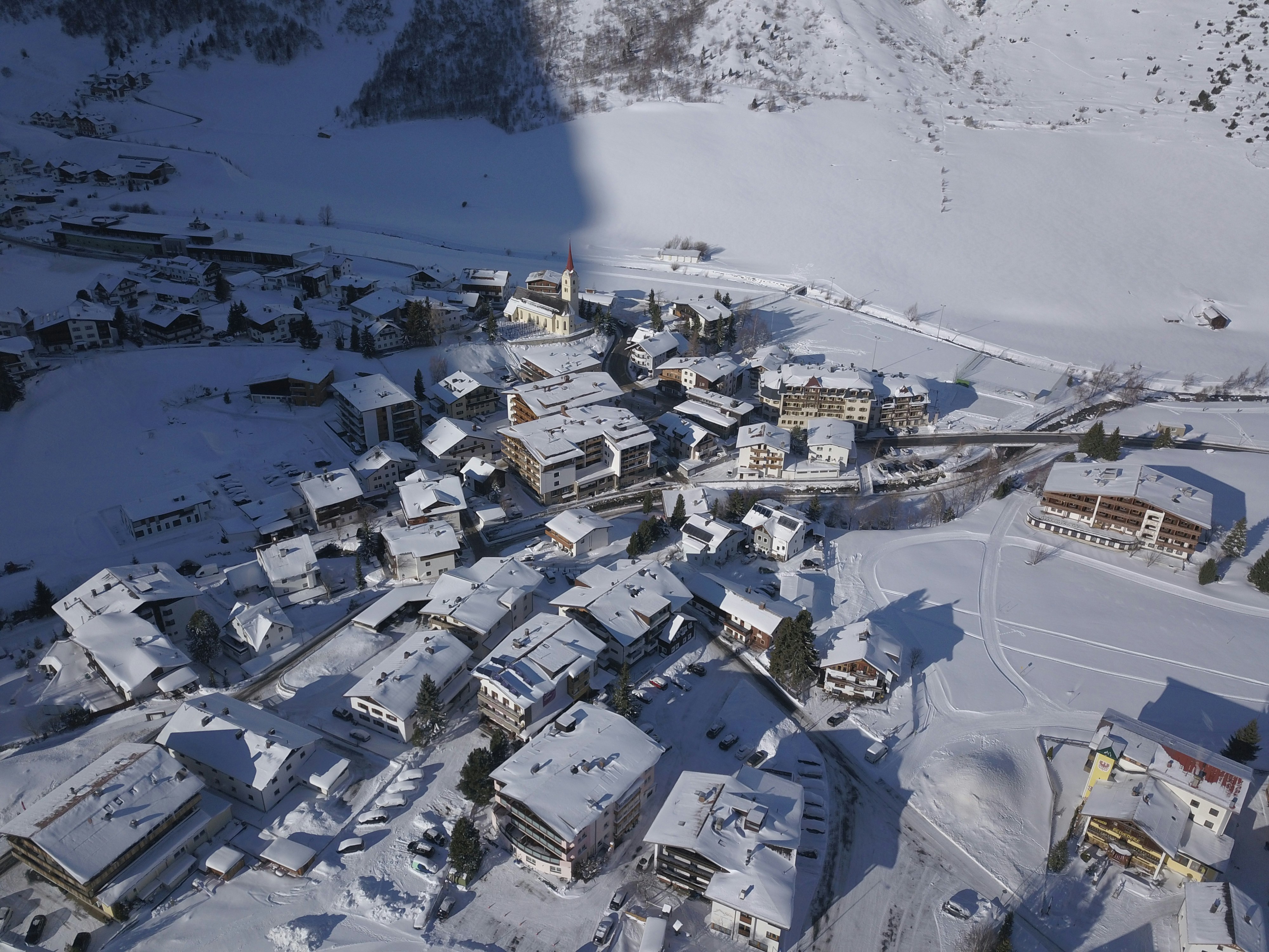 aerial view of ski slopes and snow-covered homes in Crested Butte CO