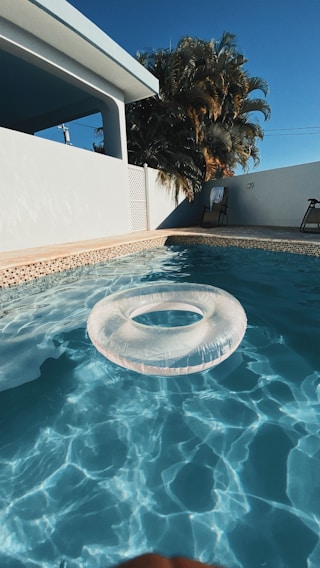 white life donut on swimming pool