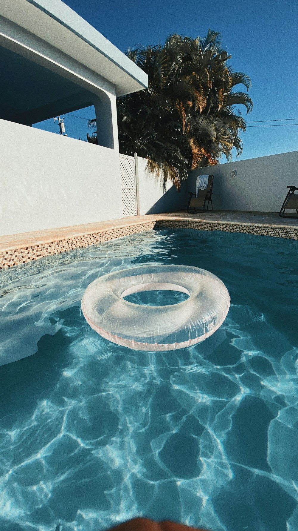 white life donut on swimming pool