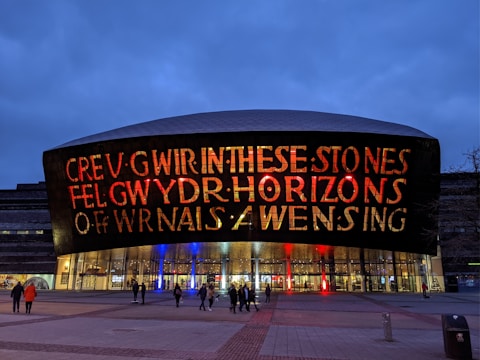 Volunteers helping build a community center in a Welsh town