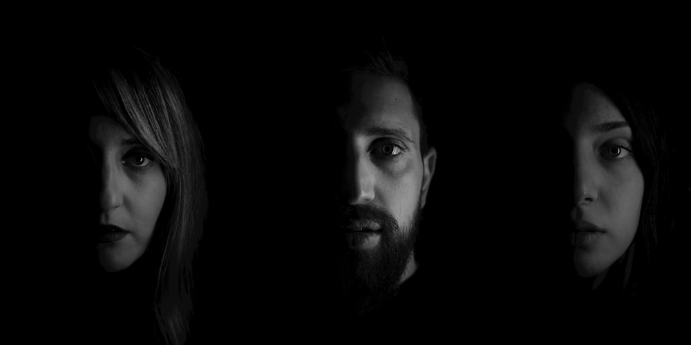 grayscale photography of man and woman