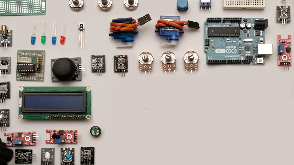 assorted-color capacitors on white surface