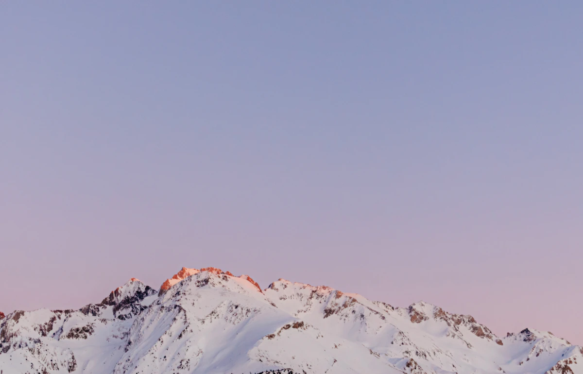 Snow covered peaks of the Pyrenees under a clear winter sky