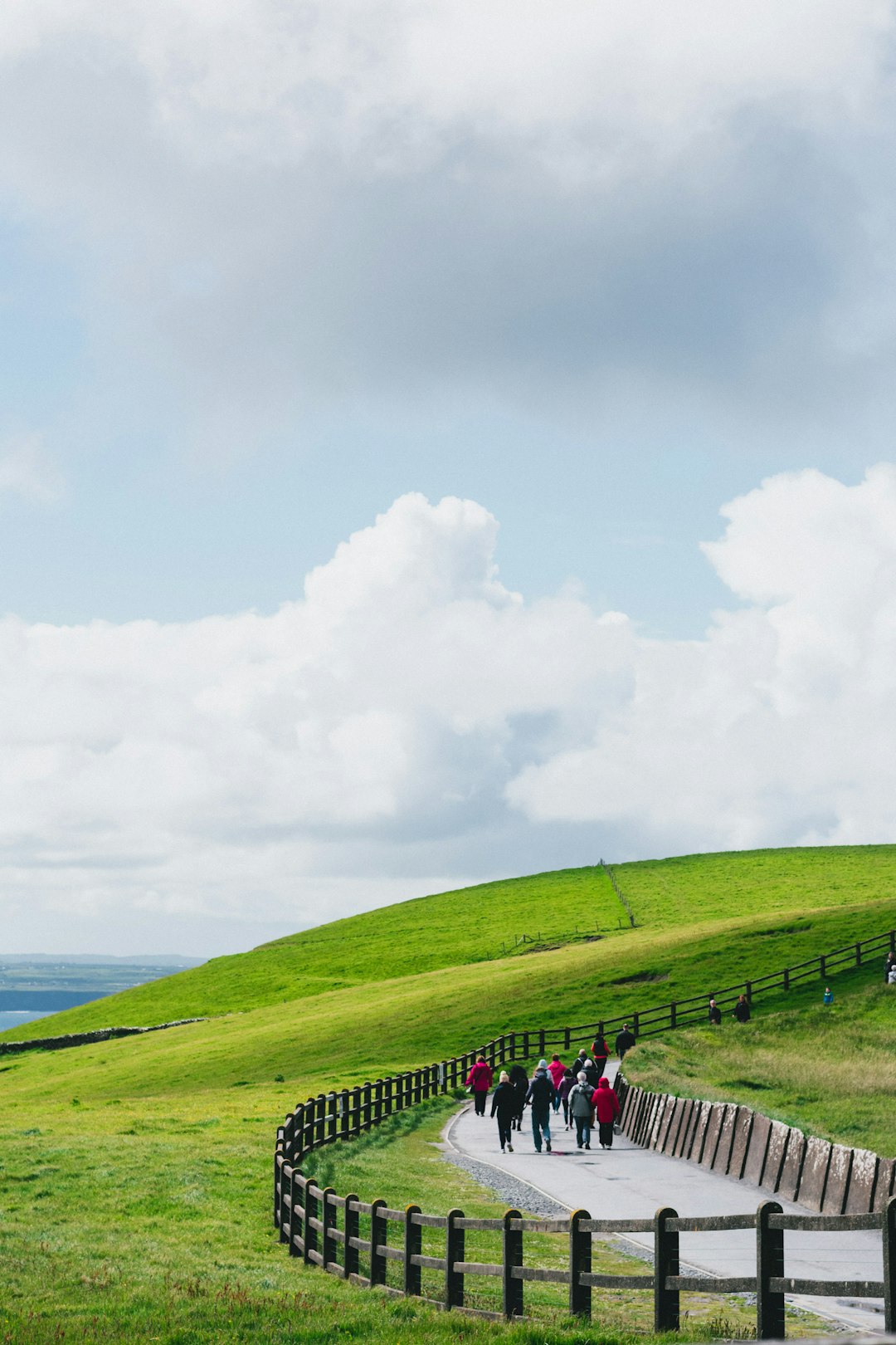 group of people on a hike towards to the mountain