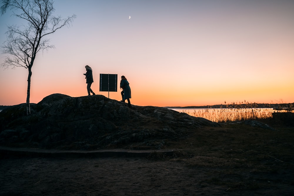 two person on rock