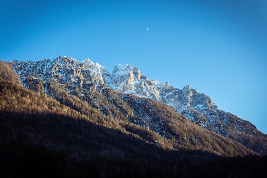 landscape photography of green and white mountain in Lake Jasna Slovenia