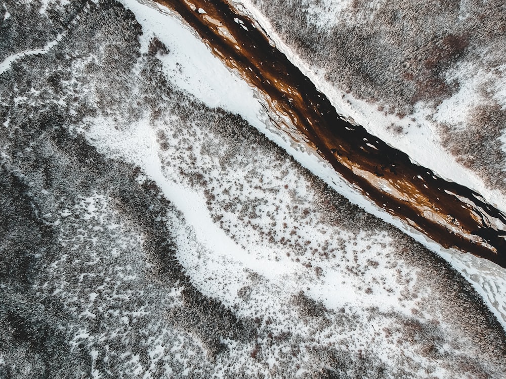 an aerial view of a snow covered field