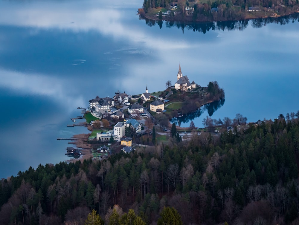 town in the middle of a lake surrounded by trees
