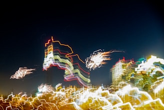 An abstract shot of city lights blurred into streaks of charcoal and violet, evoking late-night introspection.