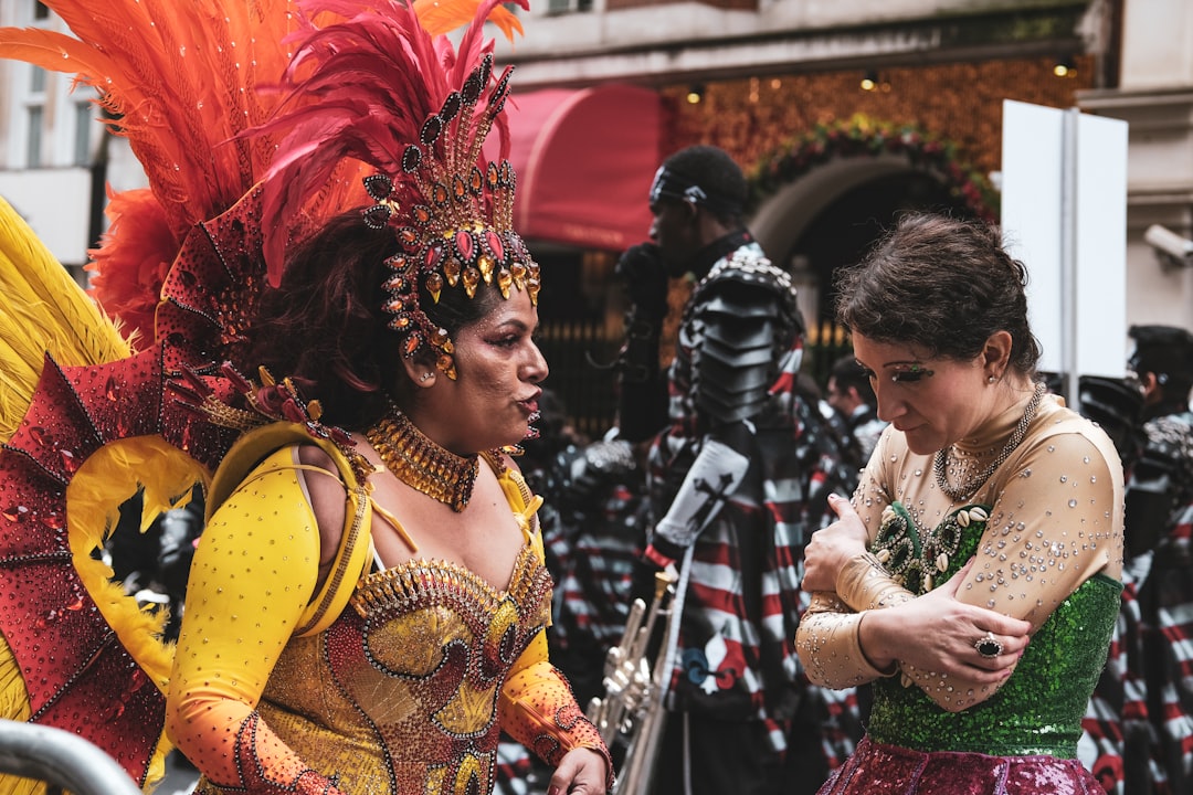 selective focus photography of women wearing feather costumes during daytime