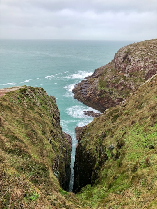 green sea cliff during daytime in Cap Fréhel France