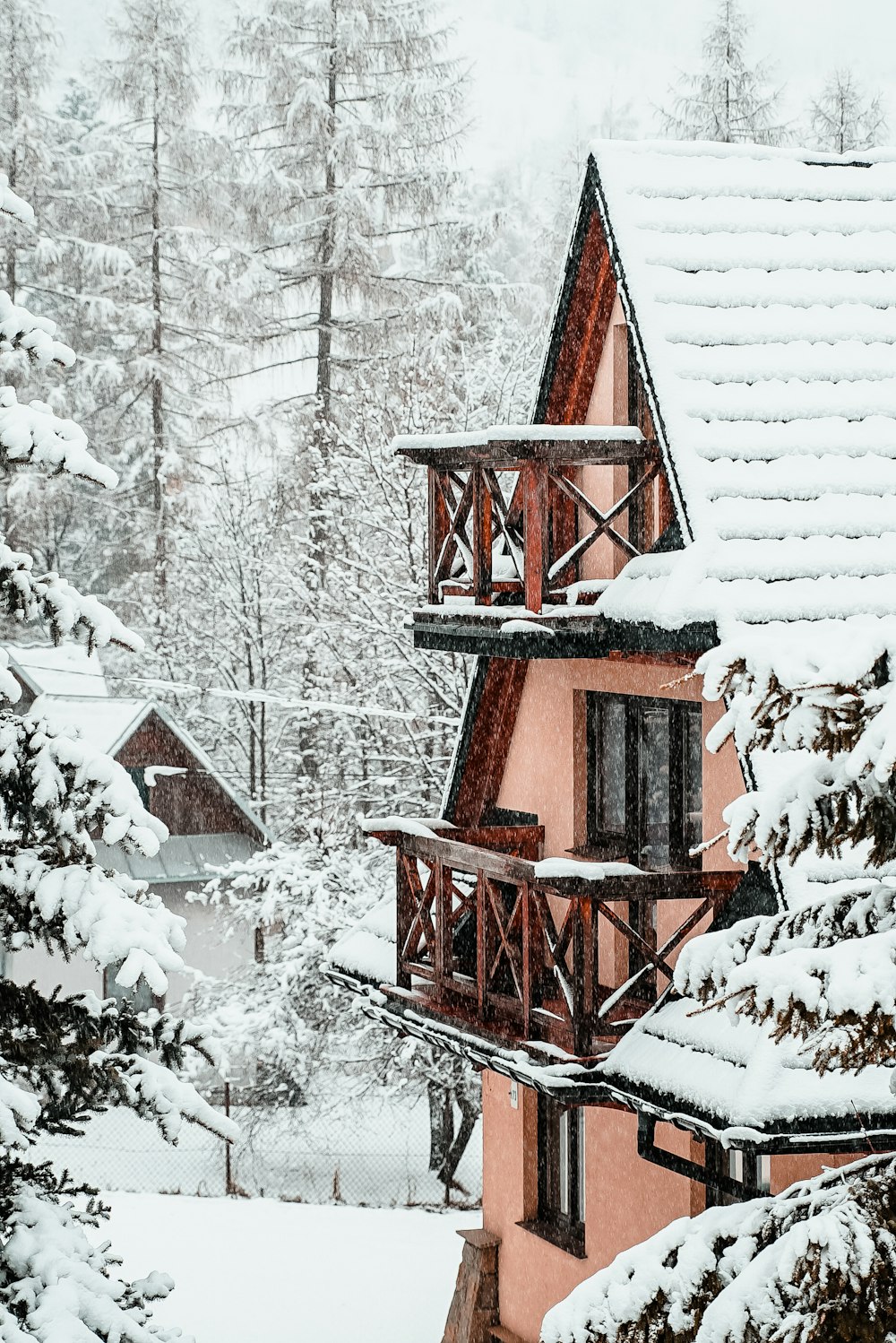snow covered house with terraces during daytime