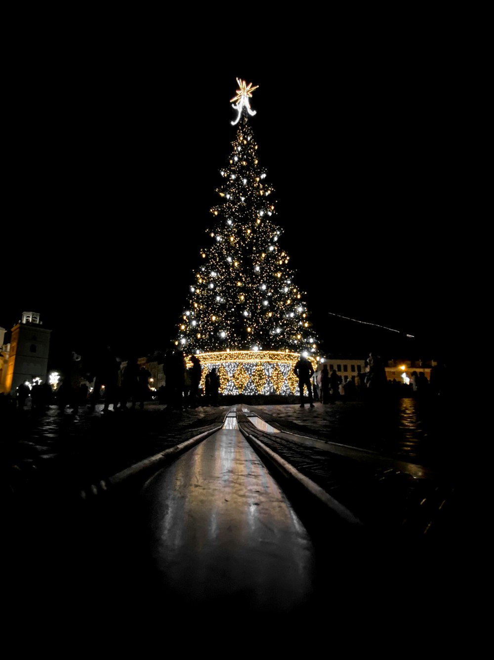 turned-on Christmas tree at night