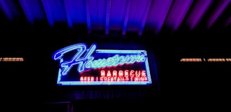 A clean, modern website homepage for a neighborhood bar featuring bold visuals and easy navigation.