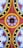 A colorful geometric pattern consisting of circular and semi-circular shapes with red, yellow, blue, and black colors arranged symmetrically. The design features a central circular motif with surrounding crescent and spiked shapes, accented by polka dots.