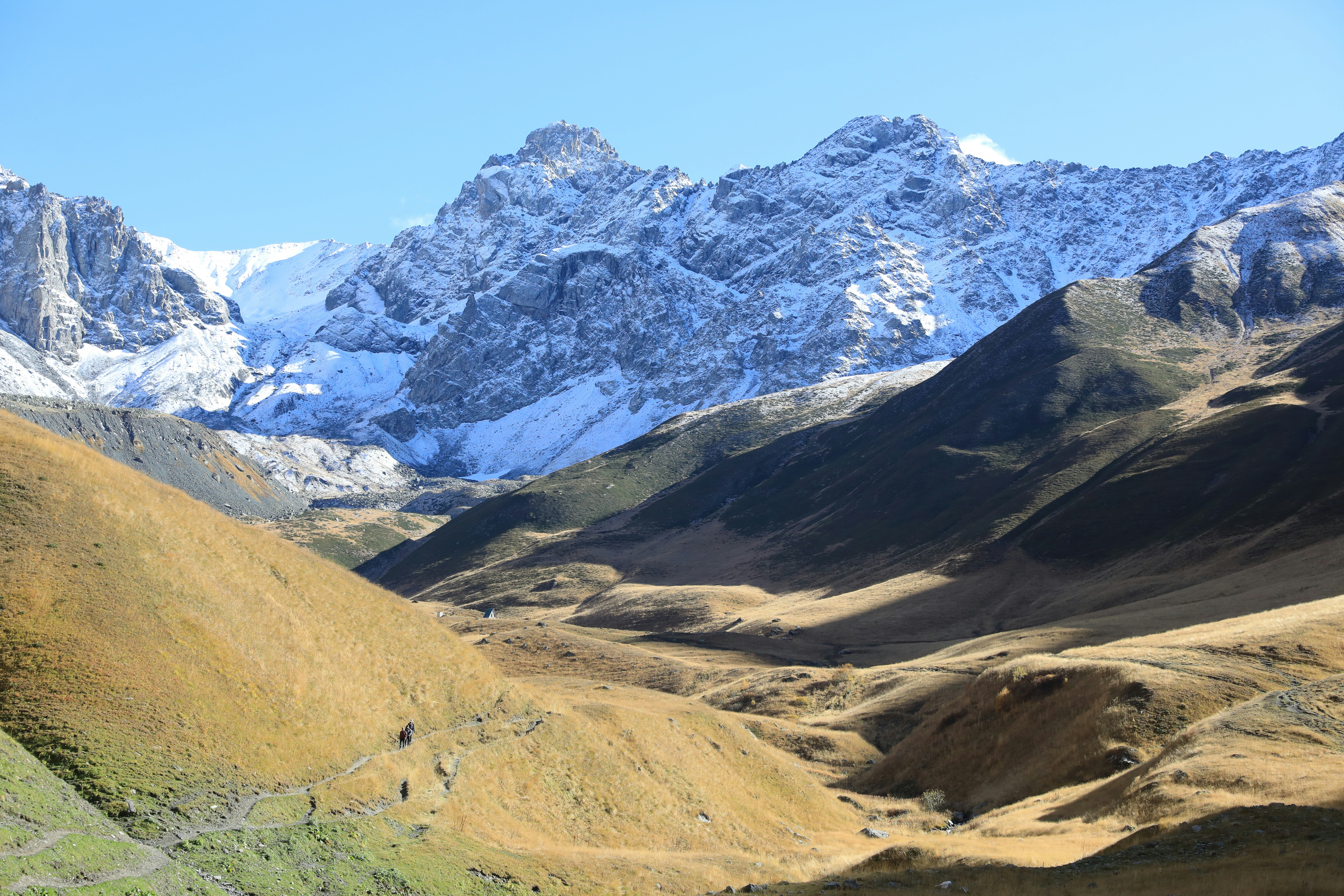 snow covered rock formation during daytime