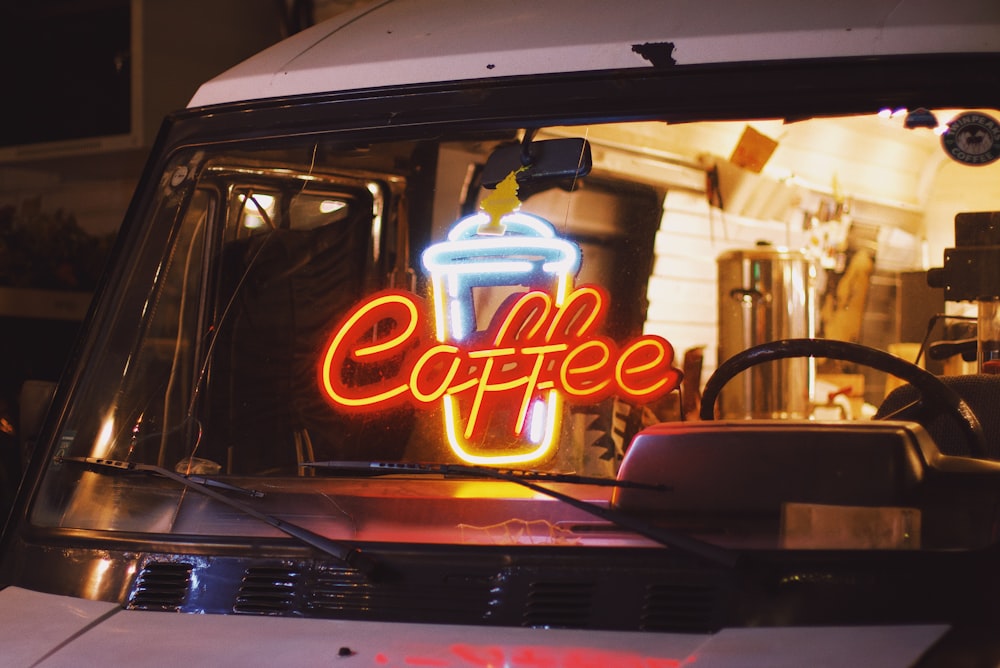 gray vehicle with coffee neonlight on windshield