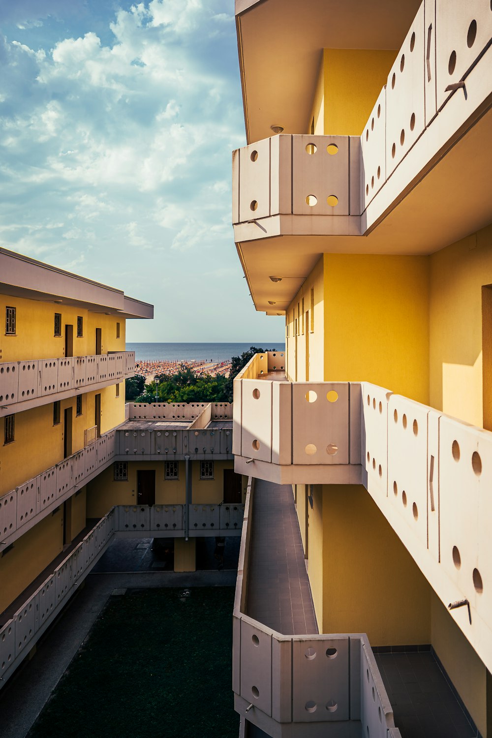 yellow and white 4-storey buildings during daytime