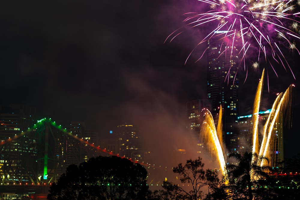 fireworks near lighted bridge