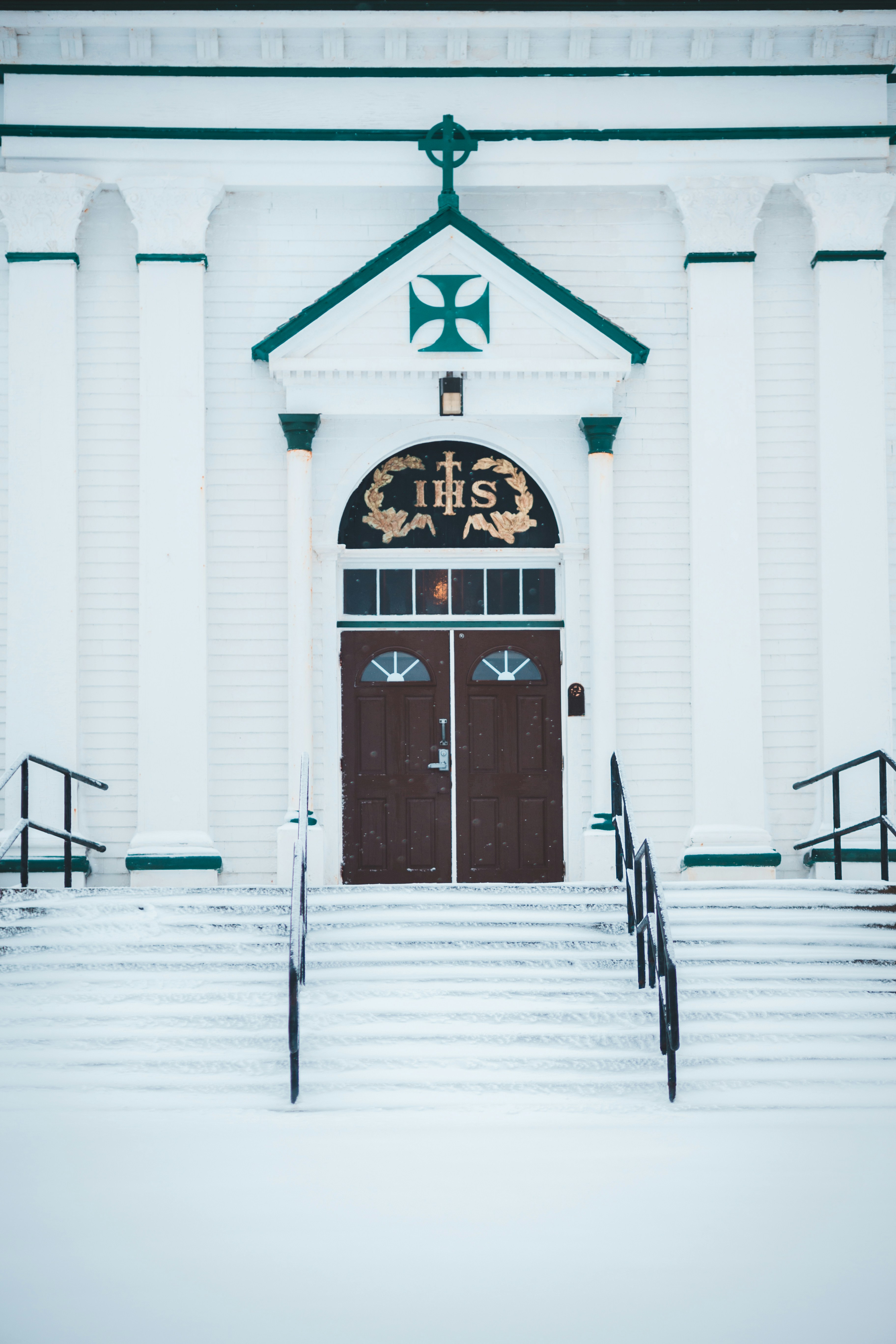 a church with stairs covered in snow