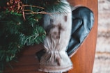 Close-up of cozy winter gloves and hats arranged neatly on a wooden table.