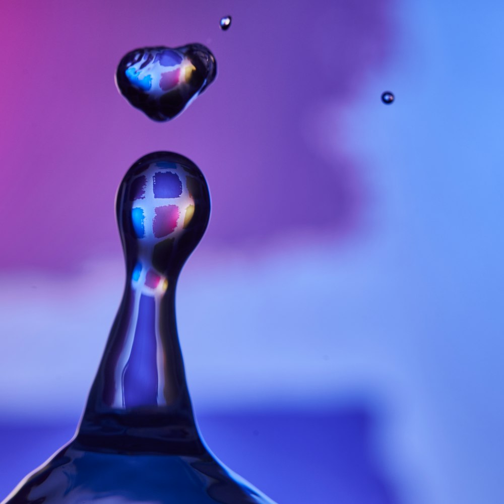 macro photography of water drop formation