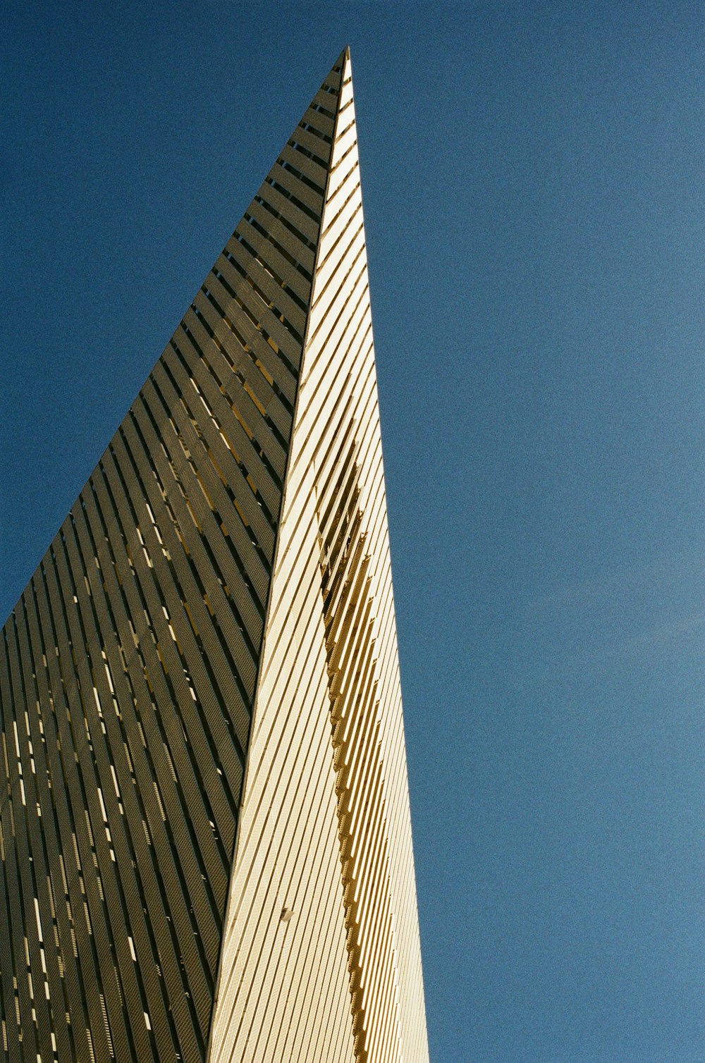 a very tall building with a clock on it's side