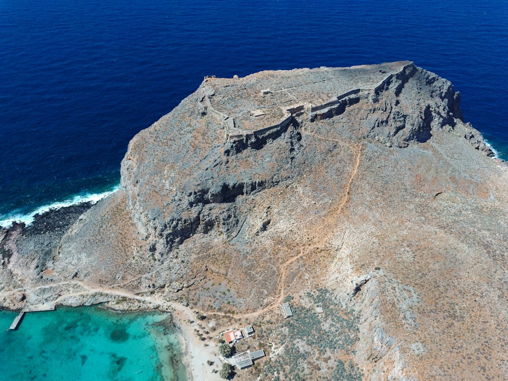 an aerial view of an island in the middle of the ocean