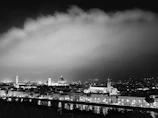 A vibrant classic photo featuring a timeless black and white cityscape at dusk.