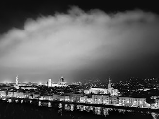 Artistic black-and-white image of a city skyline at dusk, reflecting Kushi’s travel planning inspiration