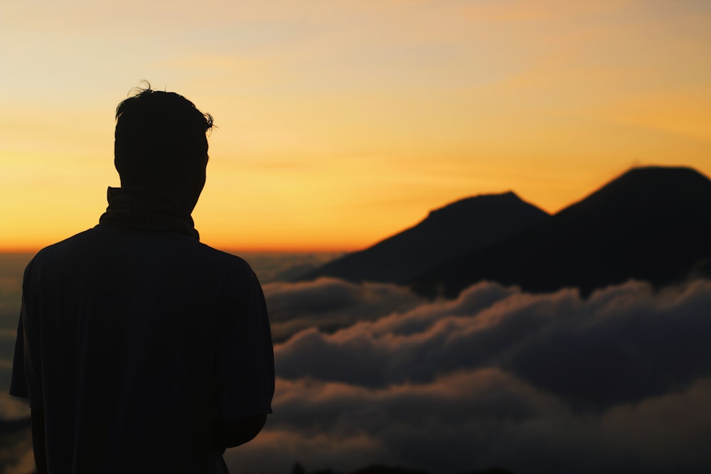 silhouette of person standing while facing back