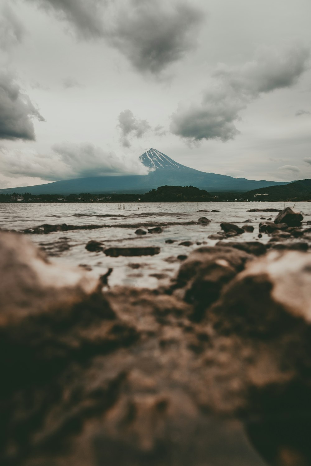 sea near mountain during daytime