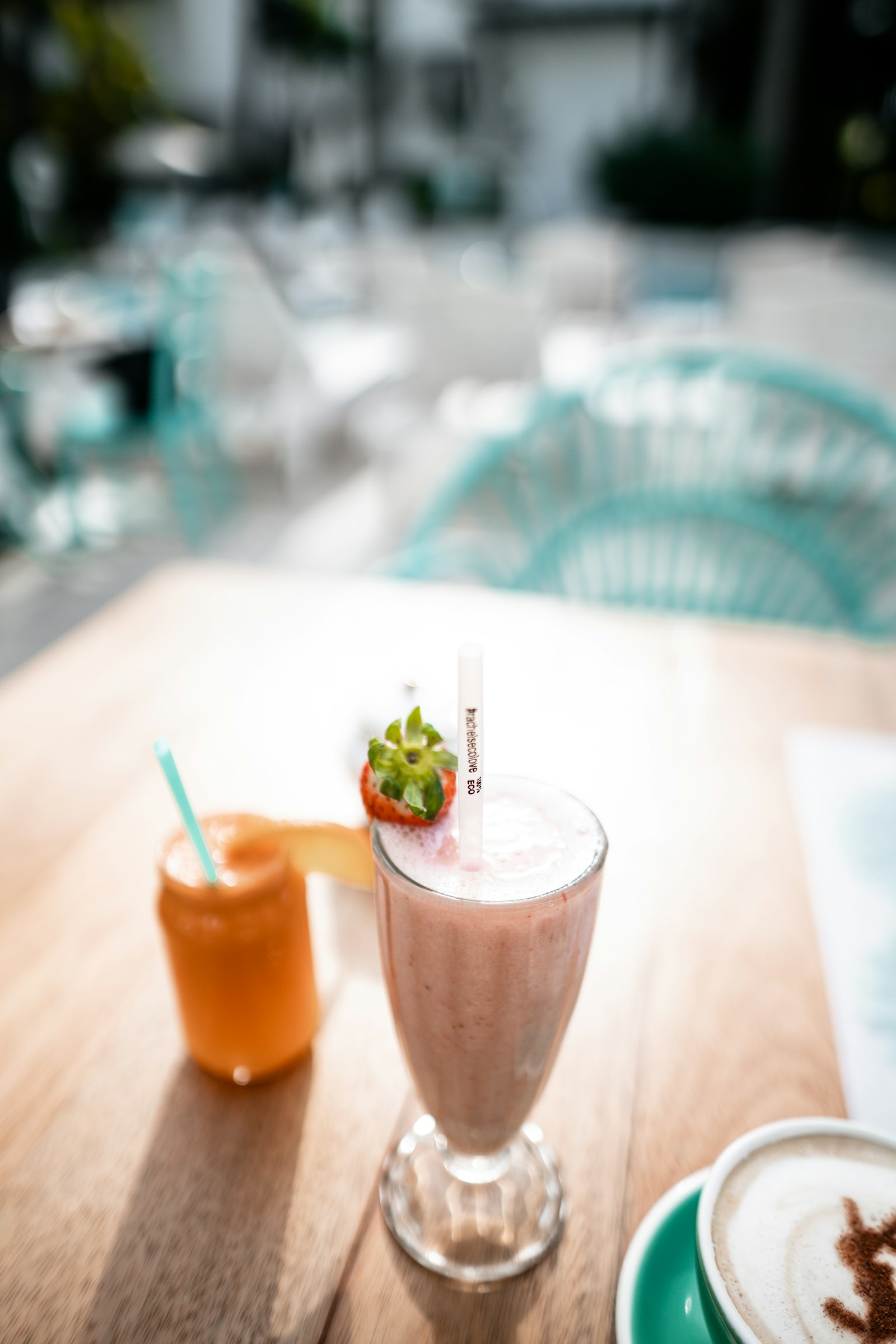 Sony a7R II + Sigma 24mm F1.4 DG HSM Art sample photo. Strawberry smoothies on table photography