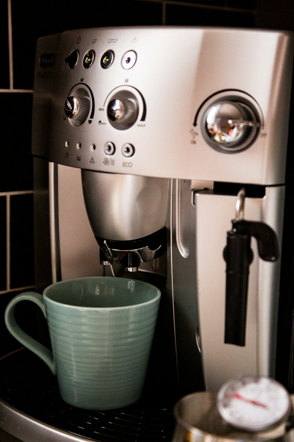 blue mug on coffeemaker