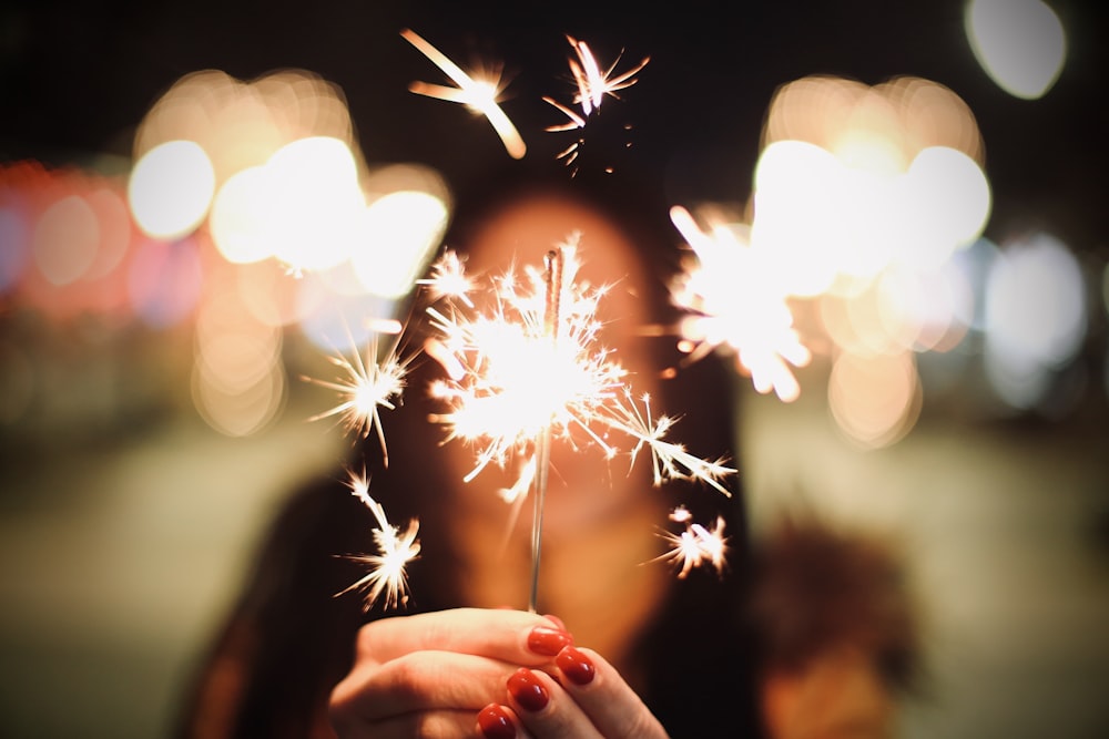 woman holding sparkler