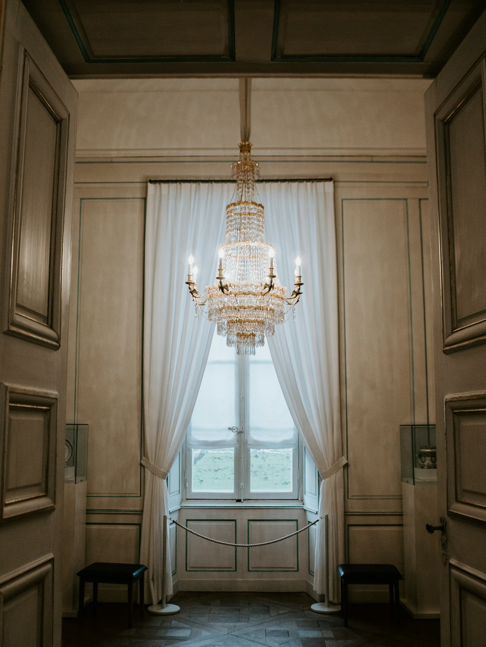 glass chandelier near window