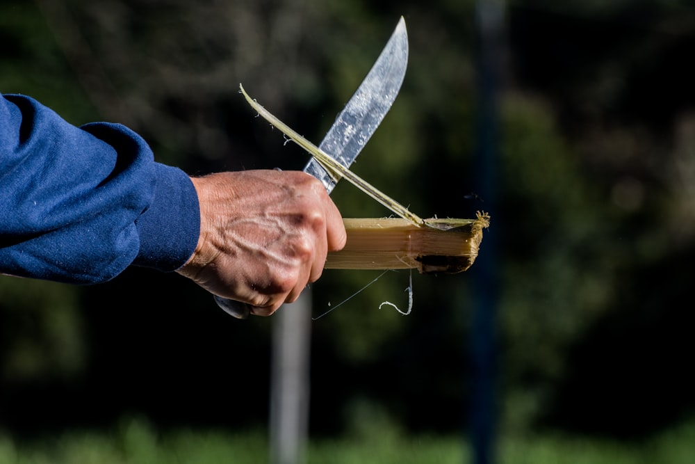 person cutting wood