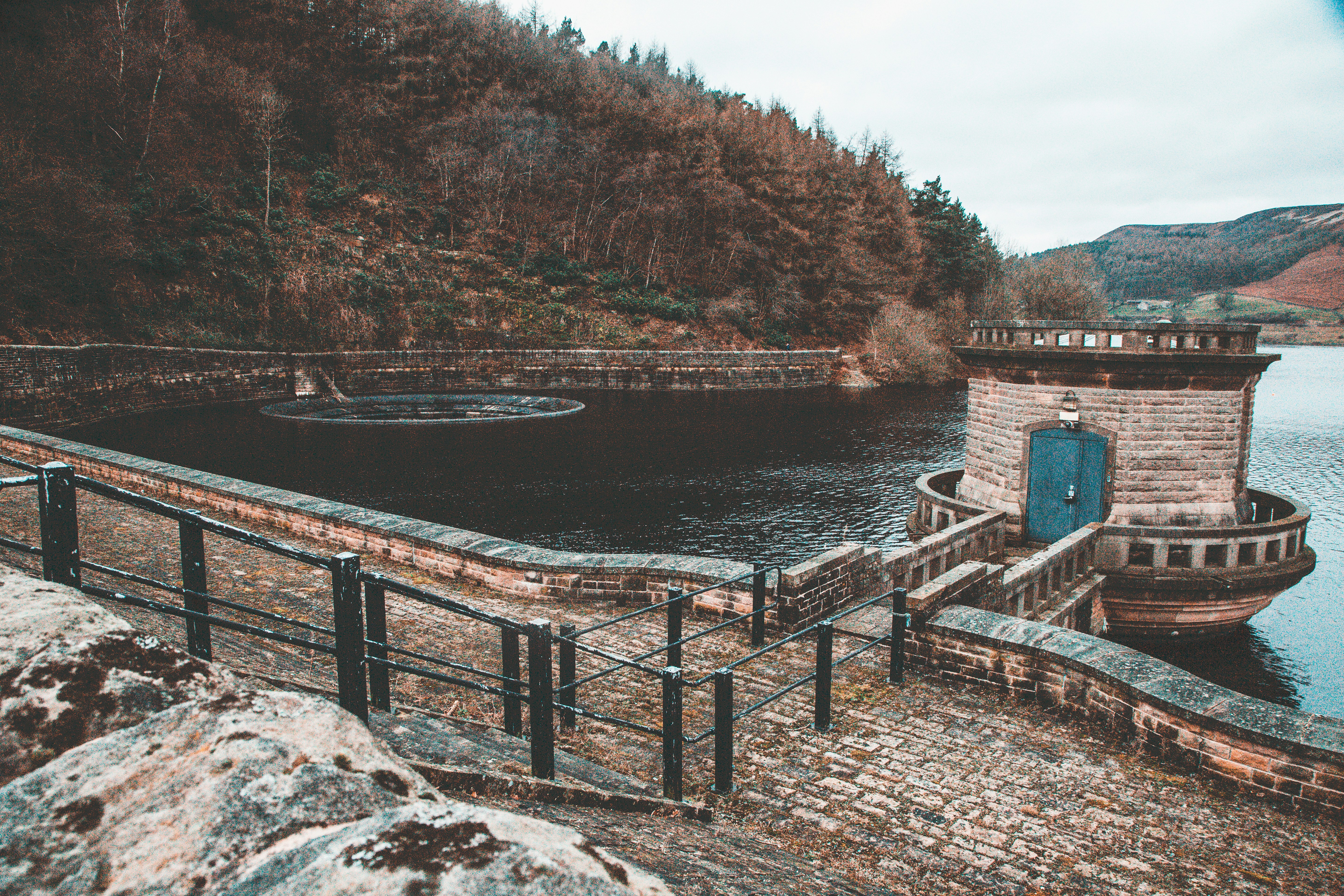 concrete tower on body of water