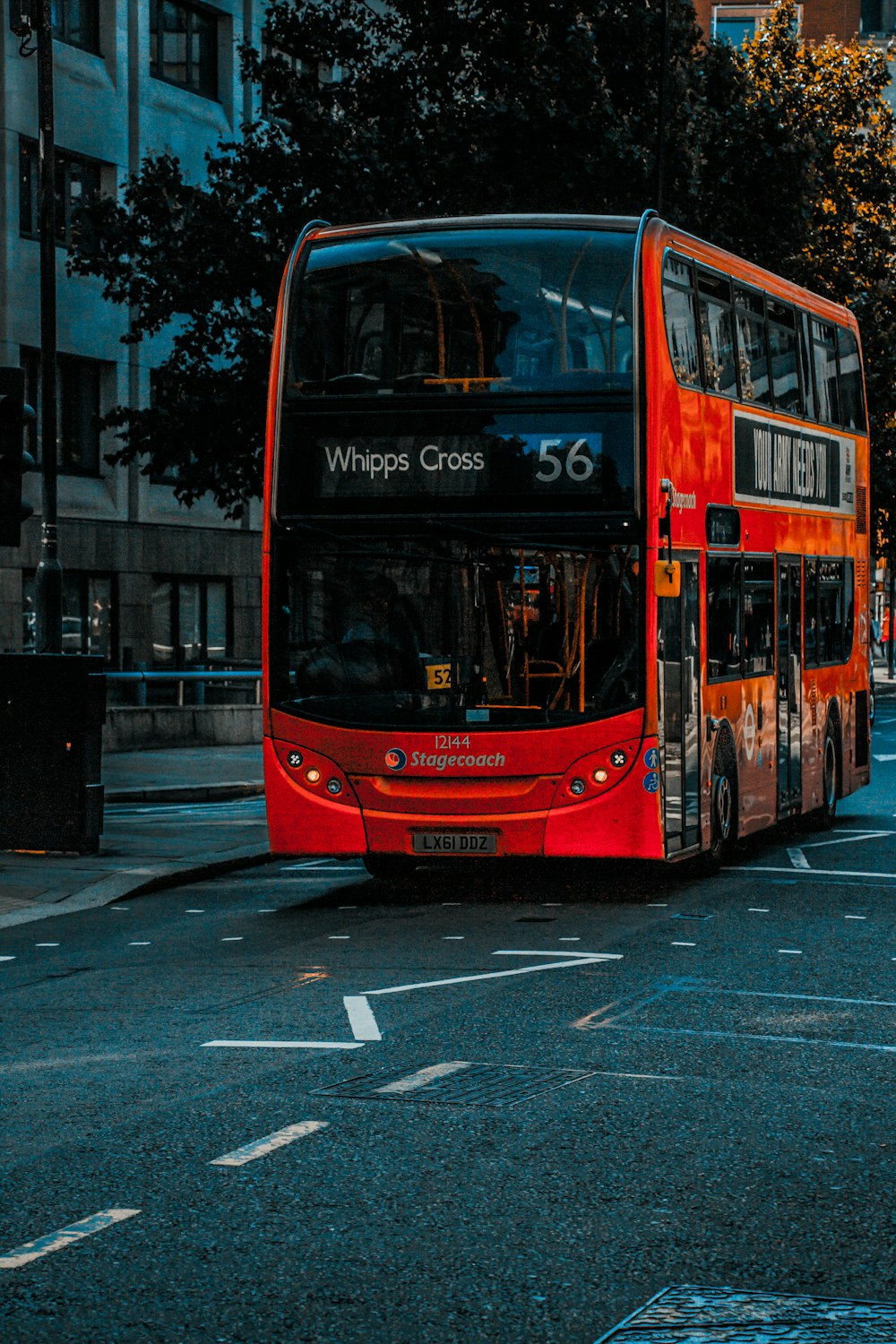 red bus on road