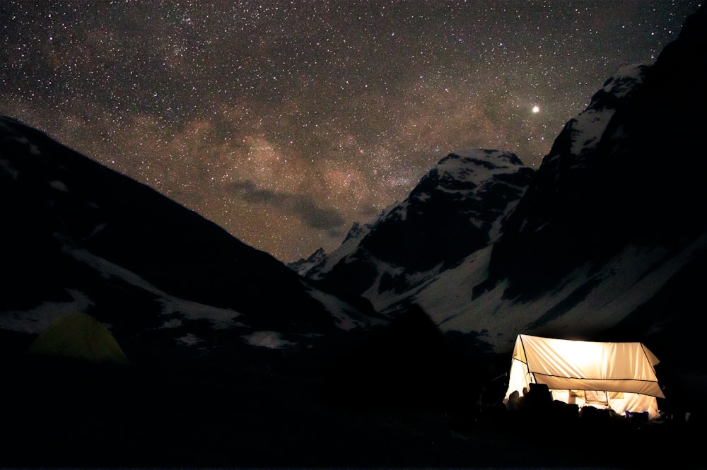 photography of snow-capped mountain range during nighttime