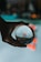 A hand is holding a crystal ball, through which a busy public market sign is viewed in a distorted, artistic manner. The background is blurred with bokeh lights, creating a dreamy and reflective ambiance.