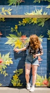 woman leaning on wall