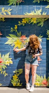 woman leaning on wall