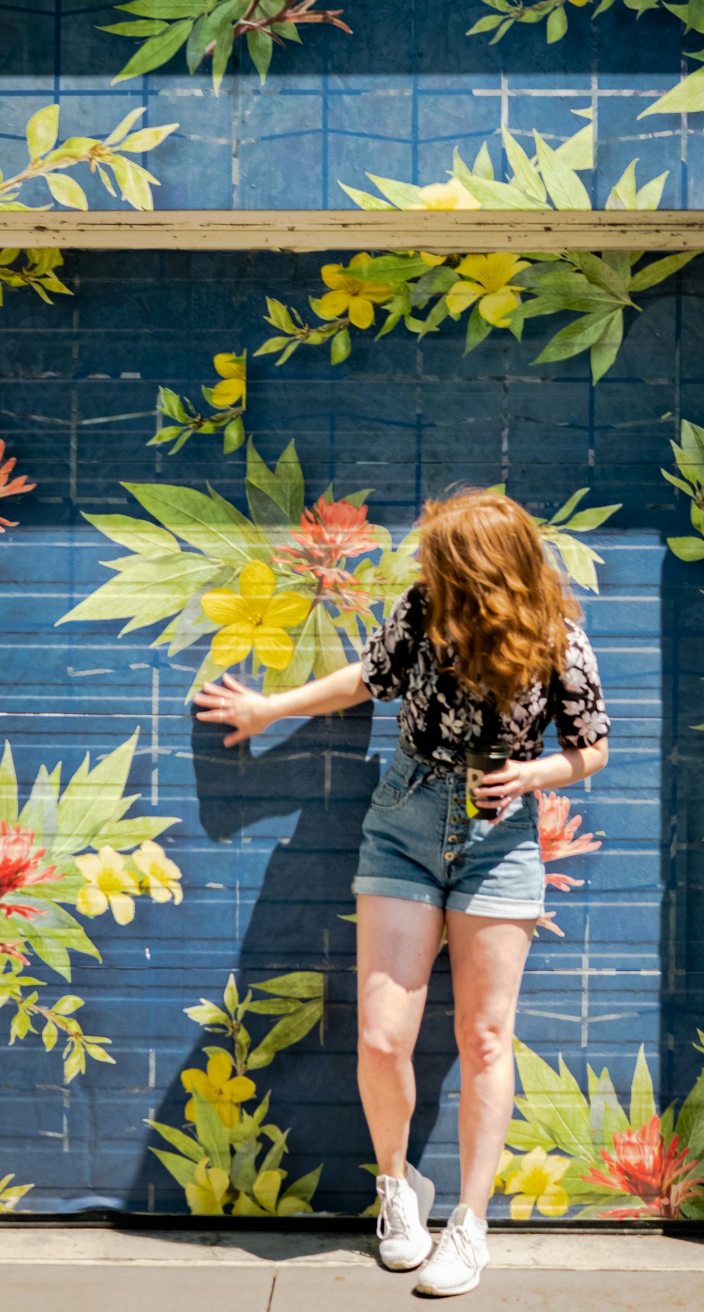 woman leaning on wall