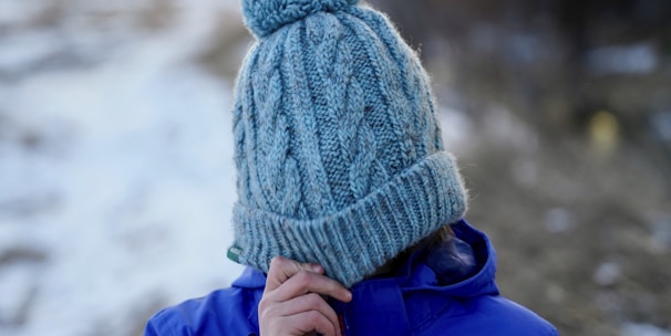 woman covering her face with knit cap