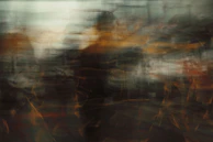 a blurry image of a man walking in the rain