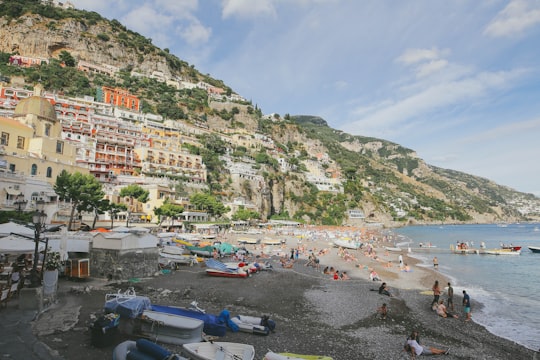 unknown persons enjoying on beach in Lattari Mountains Regional Park Italy